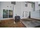 Small backyard with concrete patio and adjacent to a privacy fence at 3654 Woodland Cv, Decatur, GA 30034