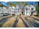 Front view of townhouses with driveway parking at 3654 Woodland Cv, Decatur, GA 30034