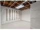 Unfinished basement area with tile floor and shelving at 4086 Pecan Nw Ct, Lilburn, GA 30047