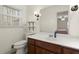 Bathroom with large mirror, updated vanity, and shelves at 4086 Pecan Nw Ct, Lilburn, GA 30047