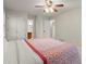 Main bedroom with ceiling fan and ample closet space at 4086 Pecan Nw Ct, Lilburn, GA 30047