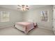 Spacious bedroom with ceiling fan and large windows at 4086 Pecan Nw Ct, Lilburn, GA 30047