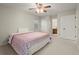 Main bedroom with ceiling fan and access to bathroom at 4086 Pecan Nw Ct, Lilburn, GA 30047