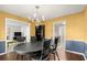 Dining room with dark wood table and built-in shelves at 4086 Pecan Nw Ct, Lilburn, GA 30047