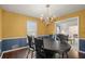 Formal dining room features hardwood floors and chandelier at 4086 Pecan Nw Ct, Lilburn, GA 30047