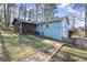 Light blue house exterior with a screened porch and stone pathway at 4086 Pecan Nw Ct, Lilburn, GA 30047