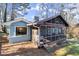 Ranch home with screened porch and blue exterior at 4086 Pecan Nw Ct, Lilburn, GA 30047