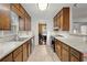 Kitchen with wood cabinets, stainless steel sink and appliances at 4086 Pecan Nw Ct, Lilburn, GA 30047