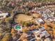 Aerial view showing community amenities including pool, clubhouse, and green spaces at 4143 N Swann St, Covington, GA 30014