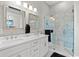 Bathroom with double vanity, marble shower, and separate toilet at 4143 N Swann St, Covington, GA 30014