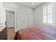 Bedroom with wood floors and ample closet space at 4143 N Swann St, Covington, GA 30014