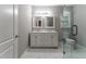 Bathroom with double vanity, marble floor, and glass shower at 2711 Glenwood Se Ave, Atlanta, GA 30317