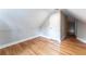 Attic bedroom with hardwood floors and access to another room at 2711 Glenwood Se Ave, Atlanta, GA 30317