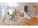 Bright dining room with hardwood floors adjacent to a kitchen and light-filled stairwell at 2711 Glenwood Se Ave, Atlanta, GA 30317