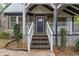 Inviting front entrance with stone detailing and a covered porch at 2711 Glenwood Se Ave, Atlanta, GA 30317