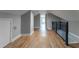 Upper hallway with hardwood floors and metal railing at 2711 Glenwood Se Ave, Atlanta, GA 30317