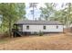 White house with black accents, and a large backyard at 2711 Glenwood Se Ave, Atlanta, GA 30317