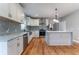 Modern kitchen with white cabinets, granite countertops, and stainless steel appliances at 2711 Glenwood Se Ave, Atlanta, GA 30317