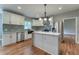 Modern kitchen with white cabinets, granite countertops, and stainless steel appliances at 2711 Glenwood Se Ave, Atlanta, GA 30317