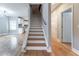 Inviting living room featuring hardwood floors, stairs, and an open view into the kitchen at 2711 Glenwood Se Ave, Atlanta, GA 30317