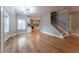 Open concept living room with hardwood floors and kitchen view at 2711 Glenwood Se Ave, Atlanta, GA 30317