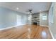 Living room with hardwood floors, fireplace, and ceiling fan at 2711 Glenwood Se Ave, Atlanta, GA 30317