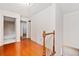 Upstairs hallway with hardwood floors and access to bedrooms at 3483 Princeton Corners Dr, Marietta, GA 30062