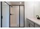 Modern bathroom featuring a glass enclosed shower with white subway tile surround at 261 Dahlia Dr, Woodstock, GA 30188