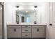 Modern bathroom featuring a double sink vanity with gray cabinets, tile flooring, and modern fixtures at 261 Dahlia Dr, Woodstock, GA 30188