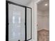 Bathroom with a walk-in shower and access to closet at 261 Dahlia Dr, Woodstock, GA 30188