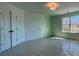 Large bedroom with double doors and window at 261 Dahlia Dr, Woodstock, GA 30188