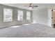 Bright and airy bedroom with three windows and ceiling fan at 261 Dahlia Dr, Woodstock, GA 30188