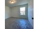 Bright bedroom with carpet flooring and large window at 261 Dahlia Dr, Woodstock, GA 30188