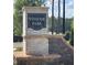 Stone monument displaying the neighborhood name Winsome Park at 261 Dahlia Dr, Woodstock, GA 30188