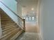 View of the foyer and staircase from the front entrance at 261 Dahlia Dr, Woodstock, GA 30188