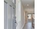 Gray front door opens to a light and airy foyer at 261 Dahlia Dr, Woodstock, GA 30188