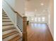 Inviting foyer features hardwood floors, staircase with iron railings and ample natural light at 261 Dahlia Dr, Woodstock, GA 30188