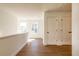 Upstairs hallway with wood floors and neutral walls at 261 Dahlia Dr, Woodstock, GA 30188