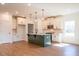 Well-lit kitchen with a functional island, modern appliances, and plenty of cabinets at 261 Dahlia Dr, Woodstock, GA 30188