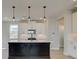 Modern kitchen with white cabinets and a large kitchen island at 261 Dahlia Dr, Woodstock, GA 30188