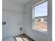 Laundry room featuring built-in shelving and a window at 261 Dahlia Dr, Woodstock, GA 30188