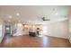 Expansive living room featuring hardwood floors, recessed lighting, and an open layout at 261 Dahlia Dr, Woodstock, GA 30188