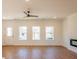 Bright living room with hardwood floors, large windows, and a modern fireplace at 261 Dahlia Dr, Woodstock, GA 30188