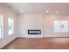 Bright and airy living room with modern fireplace, hardwood floors, and lots of natural light at 261 Dahlia Dr, Woodstock, GA 30188