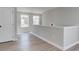 Spacious loft area with neutral walls and wood-look flooring at 261 Dahlia Dr, Woodstock, GA 30188