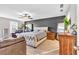 Main bedroom with king-size bed and gray accent wall at 3501 Great Sky Pkwy, Canton, GA 30114