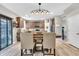 Kitchen dining area features a farmhouse table and pendant lighting at 3501 Great Sky Pkwy, Canton, GA 30114