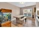 Dining room with large wooden table, benches, and fish tank at 3501 Great Sky Pkwy, Canton, GA 30114