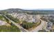 Aerial view of a new home community with numerous houses and surrounding green areas at 5247 Flannery Chase Sw, Powder Springs, GA 30127