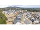 Aerial view of a community with houses, roads, and a hill in the background at 5247 Flannery Chase Sw, Powder Springs, GA 30127